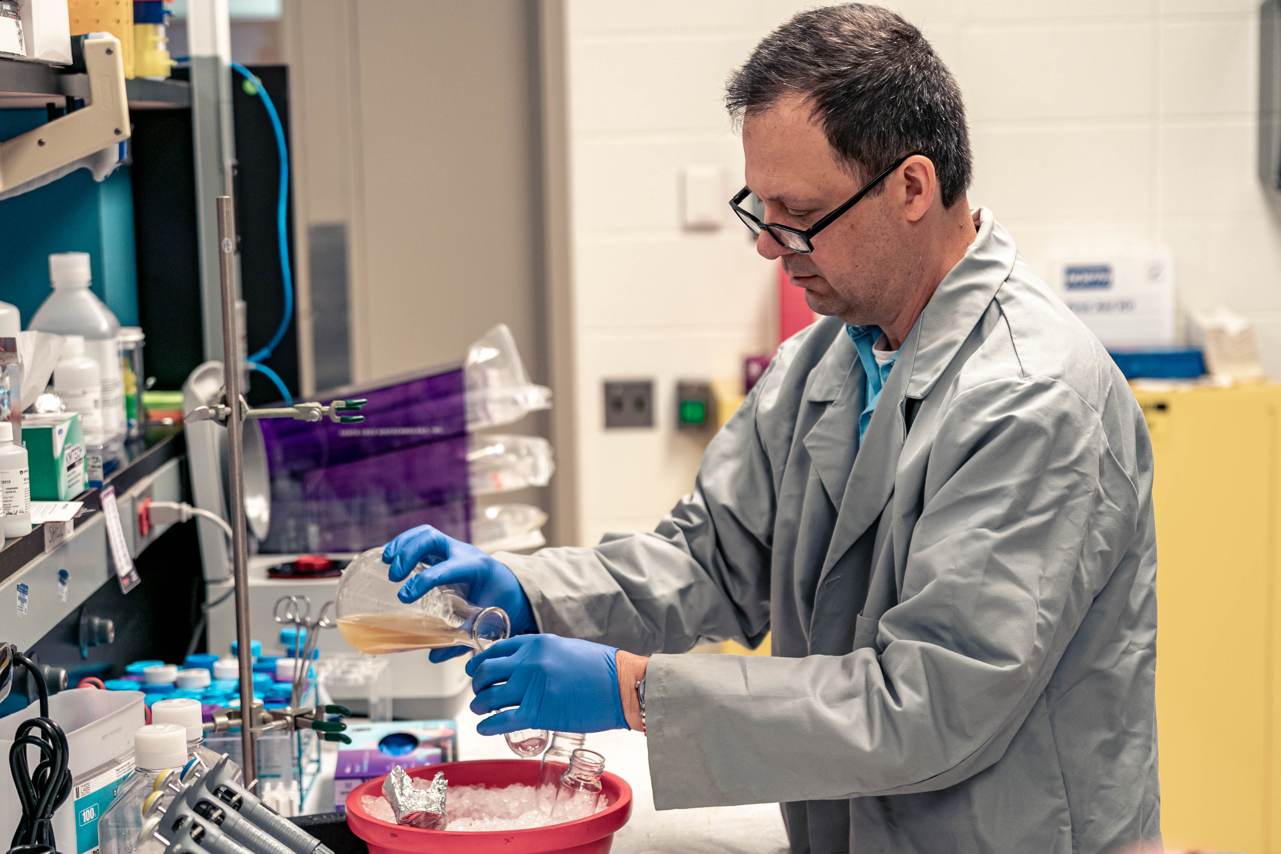 Erik Larson, PhD, measures quantities in a lab at the W.E. Upjohn M.D. Campus in Kalamazoo