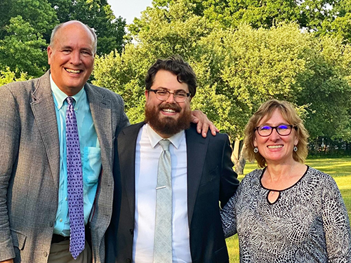 Dr. Eric Edewaard with Drs. Joanne Baker and Mark Loehrke at Resident Graduation