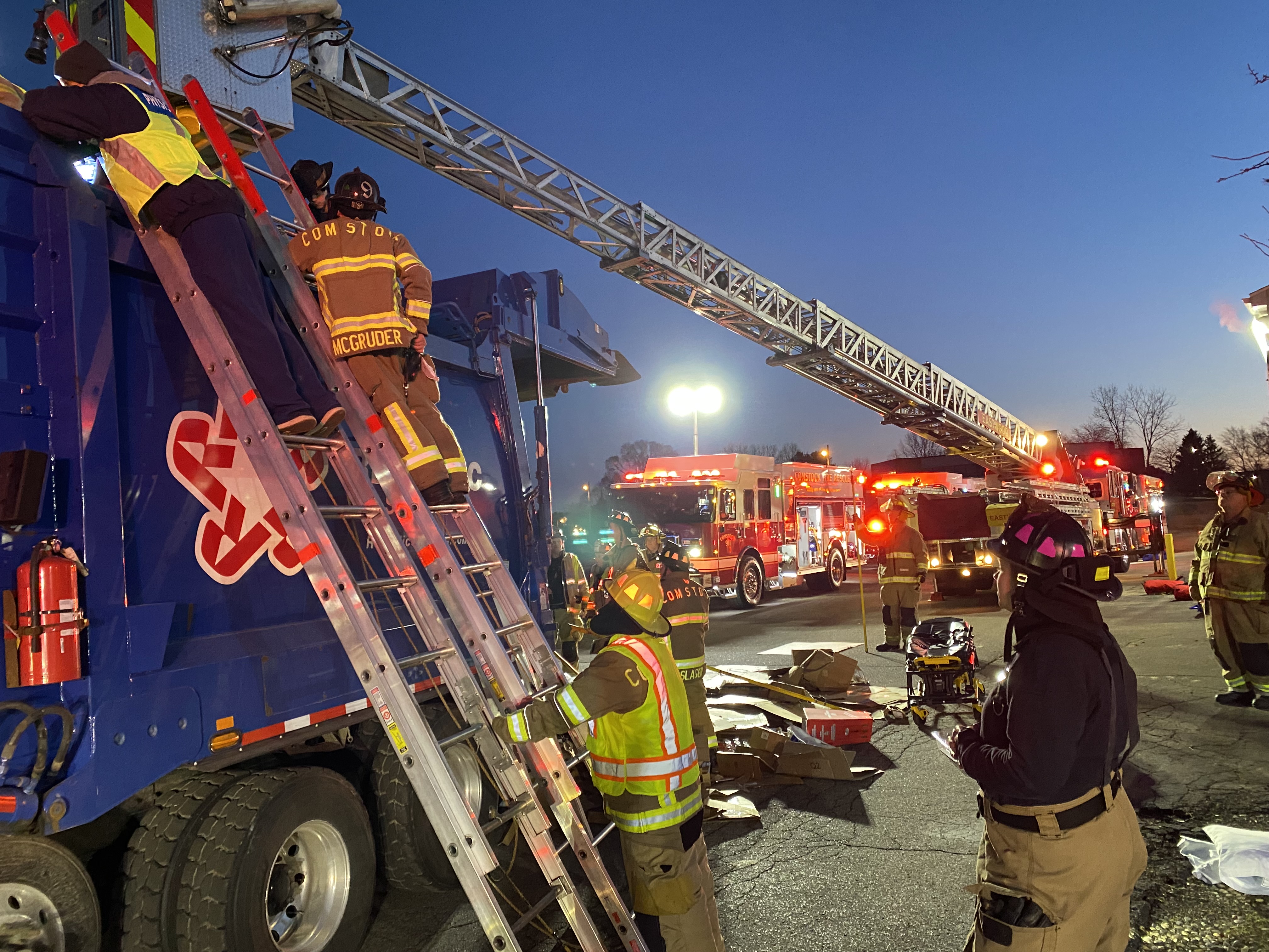 A WMed EMS physician at the scene of a tech rescue with a patient inside the compacting area of a garbage truck