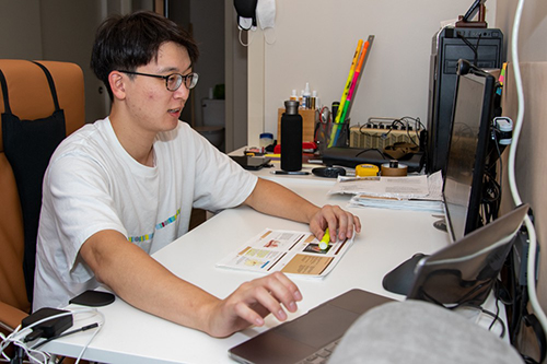 First-year medical student Sung Jik Cha studies at his home office outfitted with a large desk where he can watch lectures and spread out his papers.