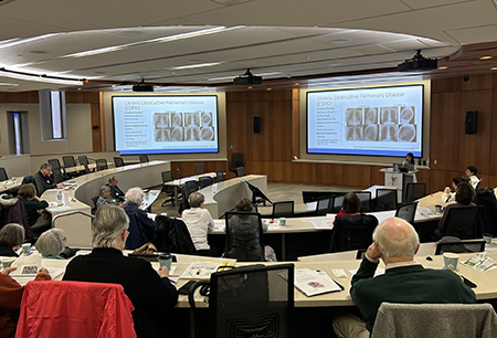 Attendees gather in the auditorium during Mini Medical School 