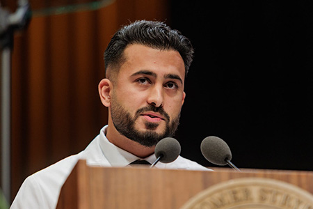 M2 Omar Shaikh speaks at the MD Class of 2029 White Coat Ceremony