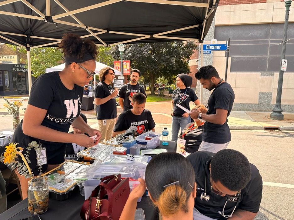 WMed students volunteering in August 2025 at the Emancipation Jubilee in Kalamazoo